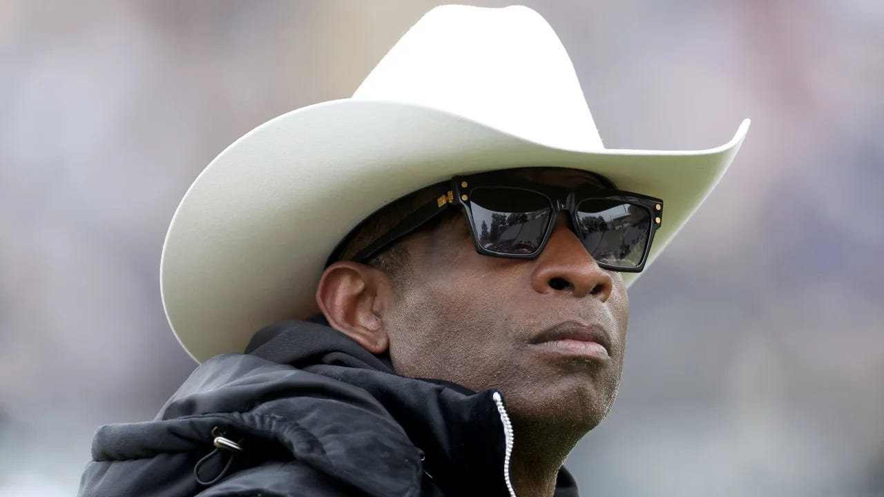Coach Prime wearing a white cowboy hat